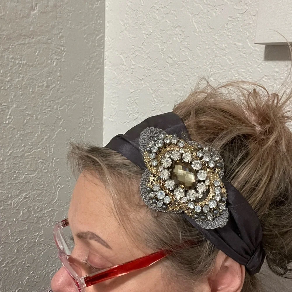 Headband, sparkling fabric and stunning brooch